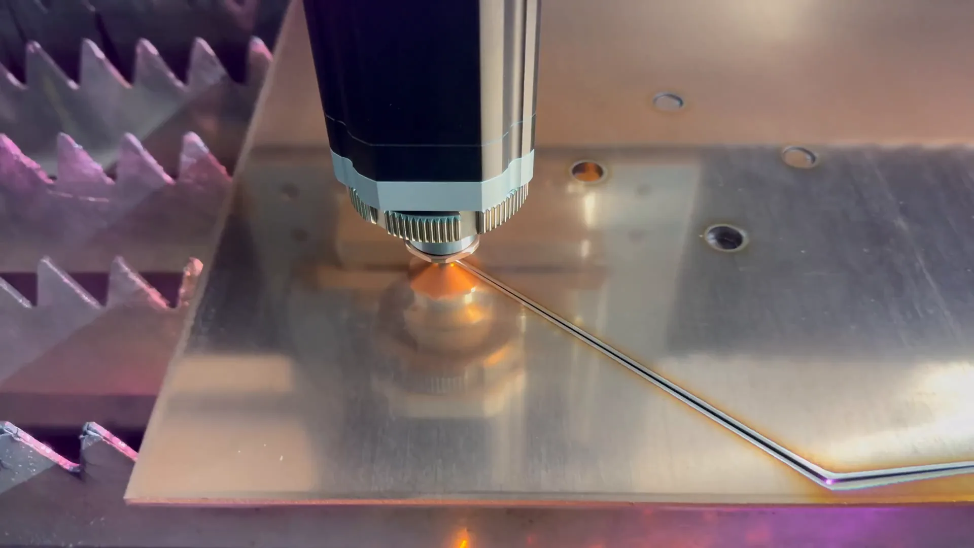 Fibre laser cutting steel in the Roofing Depot factory